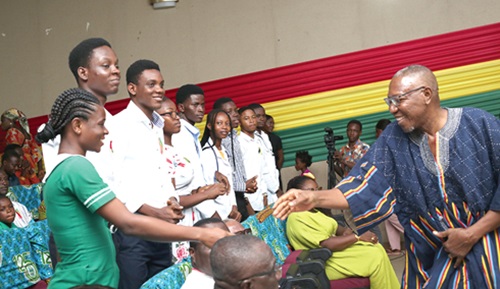 Dr Clement Apaak, Deputy Minister of Education, congratulating someDr Clement Apaak, Deputy Minister of Education, congratulating some scholarship beneficiaries at the ceremony. Picture: BENEDICT OBUOBI scholarship beneficiaries at the ceremony. Picture: BENEDICT OBUOBI