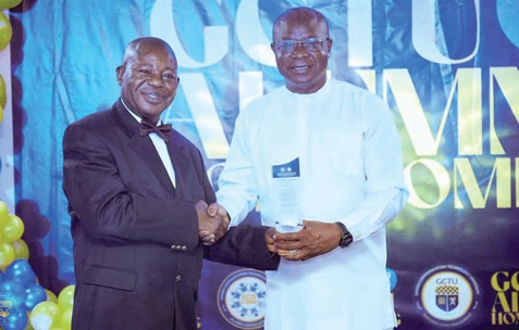  Dr Abdulai Alhassan (right) receiving the Platinum award from Prof. Ebenezer Malcalm, acting Pro Vice-Chancellor of GCTU, at the ceremony