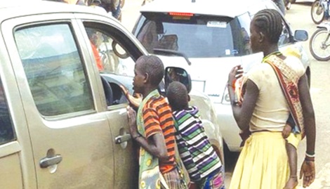Child beggars harassing an occupant of a vehicle