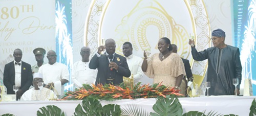Asantehene, Otumfuo Osei Tutu II (holding mic), with his wife, Lady Julia Osei Tutu (2nd from right), and Dr Ibn Chambas (right), former President of the ECOWAS Commission, proposing a toast to honour Alhaji Yusif Ibrahim (seated left), on his 80th birthday, held at the Manhyia Palace in Kumasi last Friday. Picture: EMMANUEL BAAH