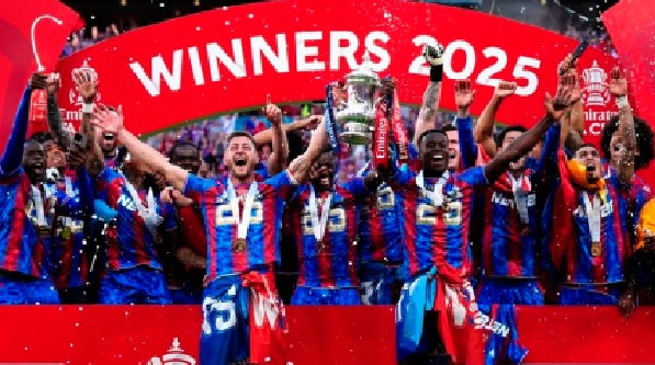 Players of Crystal Palace celebrating with the FA Cup trophy