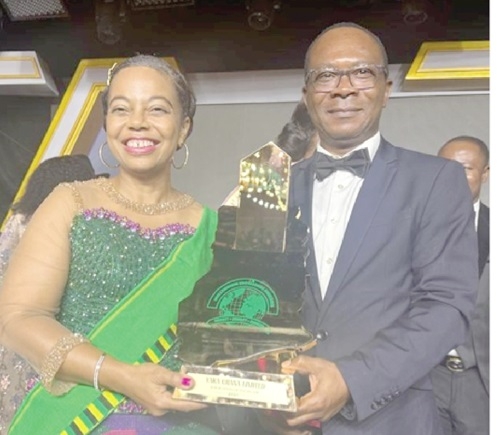  Theresa Randolph (left), Country Manager, and Kudjoe Agbenyega,  Chief Financial Officer, both of Yara Ghana, displaying the award