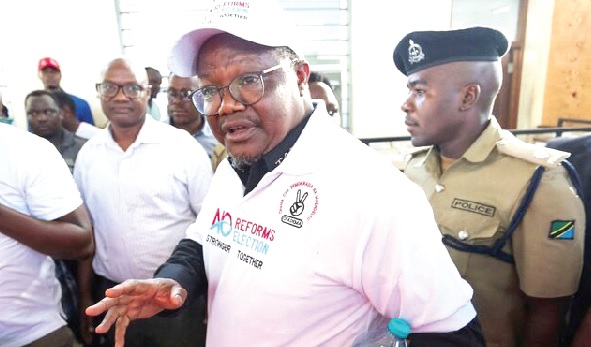 • Tundu Lissu, Tanzanian opposition leader, being escorted to court by police in the capital, Dar es Salam