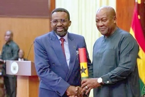 FLASHBACK: President John Mahama (right) handing  over the scroll of office to Dr Johnson Asiama,  Governor of the Bank of Ghana