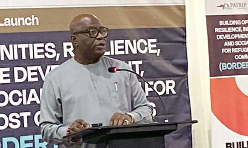 Ebenezer Oklertey Terlabi (inset), Deputy Minister for the Interior, addressing the invited guests at the launch