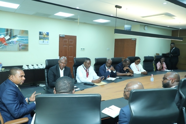 Farihan Alhassan (left), Managing Director of GCB Bank PLC, speaking to the delegation from the Graphic Communications Group Ltd (GCGL) during the meeting. Picture: EDNA SALVO KOTEY 