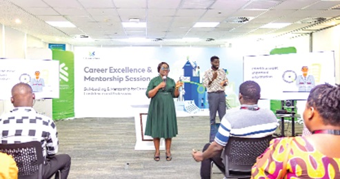 Facilitators addressing participants in the training