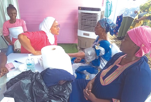 Ezzedin Memuna, Midwife, Manhyia District Hospital, attending to some of the women during the breast screening exercise.