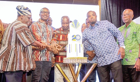 John Abdulai Jinapor (2nd from left), Godwin Kudzo Tameklo (2nd from right) and other officials cutting the anniversary cake during the event. Picture: CALEB VANDERPUYE