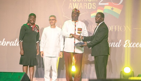 Dr Prince Ayiku (2nd from right) receiving the award on behalf of the team while other managers look on