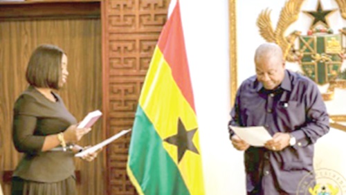 President John Mahama swearing in the new Executive Secretary of RTIC, Genevieve Shirley Lartey.  
