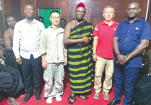 Oseadeeyo Dr Frimpong Manso IV (middle), the Omanhene of Akyem Kotoku Traditional Area, with staff of the mining company at the meeting