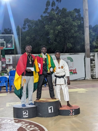 Edmund Asante (Left) with his silver medal.