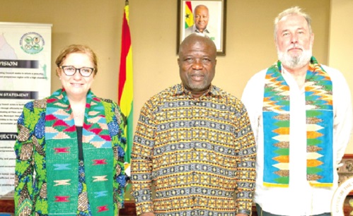 James Gunu, Volta Regional Minister, flanked by Laura Ranalli, the Italian Ambassador, and her husband, Piotr Kepinski