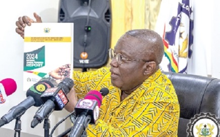 Dr Nii Moi Thompson launching the report