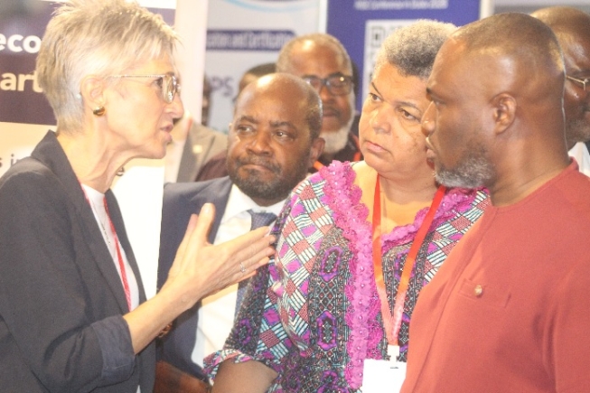 Jolanda Castagna (left), Managing Director of akka kappa Ltd., explains a point to Kenneth Gibert Adjei (right), Minister for Works, Housing, and Water Resources; Gizella Tetteh-Agbotui (2nd from right), Deputy Minister for Works, Housing, and Water Resources; and Emmanuel Jeffrey (3rd from right), Acting Chief Executive Officer of the Real Estate Agency Council (REAC) during the opening of the exhibition at the conference. Picture: ESTHER ADJORKOR ADJEI