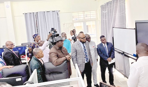 Prof. Emmanuel Ohene Afoakwa (in hat),  Vice-Chancellor of the university, and Mohammed Adams Sukparu (arrowed), Deputy Minister of Communication, Digital Technology and Innovations, with some officials touring the new facility after it was commissioned