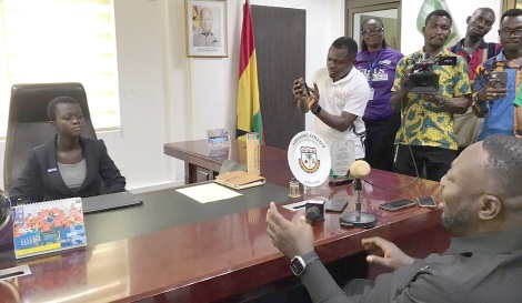 George Opare Addo (back facing camera), Minister of Youth Development and Empowerment, addressing Beatrice Laari Dammigu, the speaker of the West Mamprusi Municipality Children's Parliament, during the takeover activity to mark International Day of the Girl Child. Picture: ESTHER ADJORKOR ADJEI