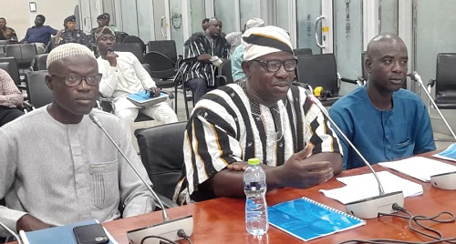 Mr Abaah (middle), the Chief Executive for the Bongo District, responding to questions from the committee members during the hearing