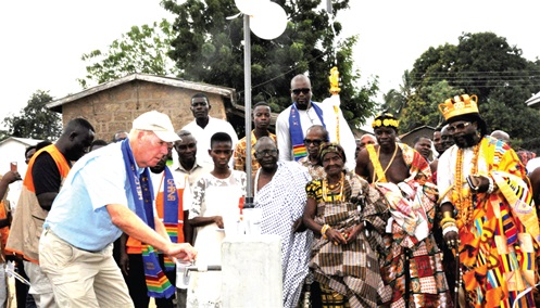 Traditional rulers of Wudzedeke and an official of World Vision by a standpipe in the community soon after the inaugurationTraditional rulers of Wudzedeke and an official of World Vision by a standpipe in the community soon after the inauguration