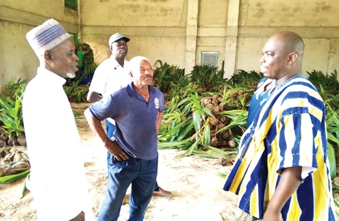 Wilfred Zuuri (right), Kintampo South District Chief Executive, interacting with some of the farmers Wilfred Zuuri (right), Kintampo South District Chief Executive, interacting with some of the farmers