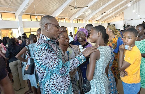 Dr Clement Abas Apaak (left), Deputy Minister of Education, with one of the students 