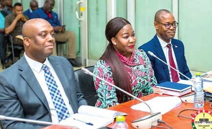 Justina Nelson (middle), CEO, Minerals Income Investment Fund (MIIF), with Thomas Nyarko Ampem (left), Deputy Finance Minister, and David Awuah Mensah, Chief Finance Officer, MIIF, before the committee 