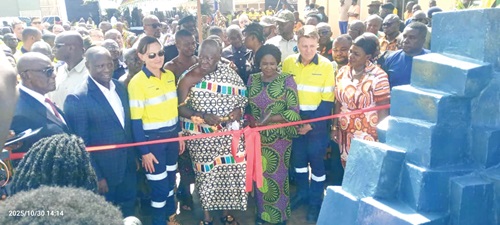 Otumfuo Osei Tutu II (3rd from left), the Asantehene, being assisted by Vice-President Prof. Naana Jane Opoku-Agyemang (3rd from right) to cut a tape to open the Newmont Ahafo North Gold Mine. With them are Emmanuel Armah-Kofi Buah (left), Minister of Lands and Natural Resources; Tom Palmer (5th from left), CEO, Newmont; Natascha Viljoen (2nd from left), President and Chief Operating Officer of Newmont, and other dignitaries