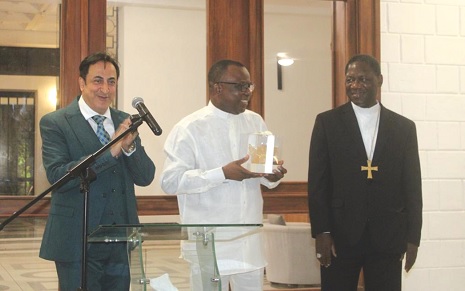 Jules Armand Aniambossou (middle), French Ambassador to Ghana, sharing words of appreciation after receiving a parting present from Maher Kheir (left), the Lebanese Ambassador and the Dean of the Diplomatic Corps