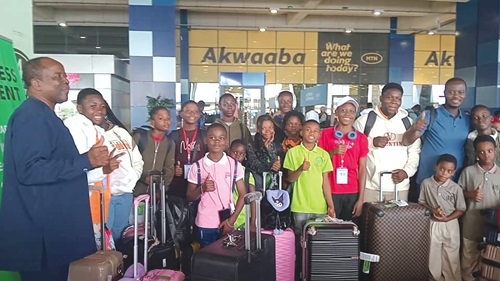 Nana Kwesi Essel (left), Nimdikesehene of Gomoa Assin Traditional Council, with some of the students after their return to Ghana