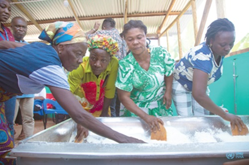 Some of the participants demonstrating how gari is produced, at the event Some of the participants demonstrating how gari is produced, at the event
