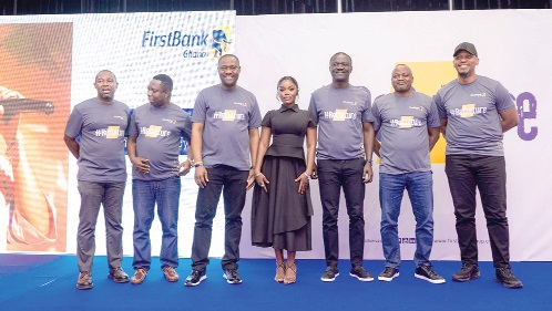 A cross-section of the FirstBank Ghana Management Committee with singer Gyakie who performed at the event