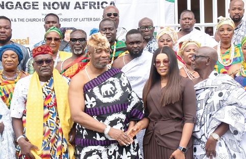 Nii Tackie Teiko Tsuru II (2nd from left), Ga Mantse, in a handshake with Cecilia Amankwah (2nd from right), the African Director and Ghana Country Director of Engage Now Africa