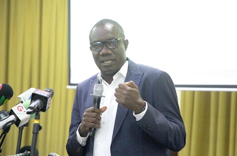 Moses Okley (right), Finance Manager of ECG, addressing the audience at the event. Picture: CALEB VANDERPUYE