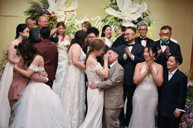 Same-sex couples at a mass wedding ceremony in Hong Kong last year. The ceremony was performed by a pastor online from the United States, as same-sex partnerships are not recognized in Hong Kong.Credit...Peter Parks/Agence France-Presse — Getty Images