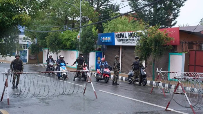 Nepalese army personnel check and question civilians at a checkpoint in Kathmandu, Nepal, Wednesday, Sept. 10, 2025. (AP Photo/Niranjan Shrestha)