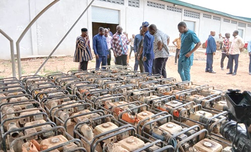 Eric Opoku (arrowed), Minister of Food and Agriculture, inspecting some of the water pumping machines to be distributed 
