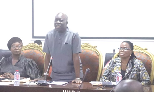 Dr Wilfred Ochan (standing), Country Representative, UNFPA, addressing members of the National House of Chiefs in Kumasi. With him are Mercy Larbi (right), Deputy Commissioner, CHRAJ, and Nana Adwoa Awindor , CEO, Obaapa Development Foundation. Picture: EMMANUEL BAAH