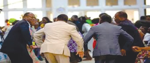 Male congregants dancing at church