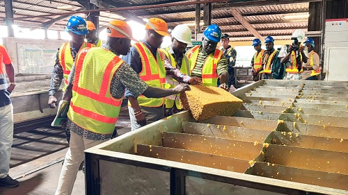 Joseph Nelson (2nd from left), Western Regional Minister, examining some of the semi-processed rubber products ready for export Joseph Nelson (2nd from left), Western Regional Minister, examining some of the semi-processed rubber products ready for export