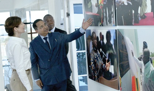 Dhananjat Tripathi (2nd from left), Chief Executive Officer, Atlantic Lifesciences Limited, showing some photographs of the company to Baroness Chapman (left), UK Minister of State, International Development