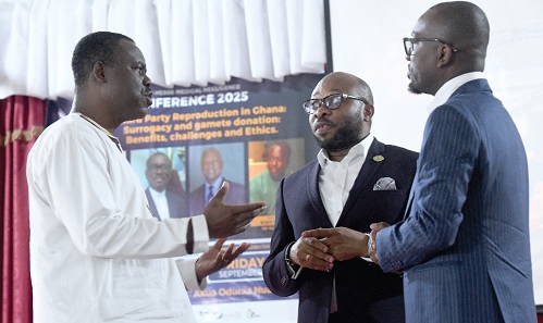 Dr Ernest Konadu (left), Head, Medical and Dental Health Service, Ministry of Health, interacting with Dr Promise Sefogah (middle), Vice-President, Fertility Society of Ghana.  Picture: SAMUEL TEI ADANO