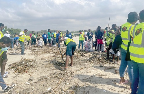 Some volunteers collecting marine debris and solid waste at the Laboma Beach Resort in Accra