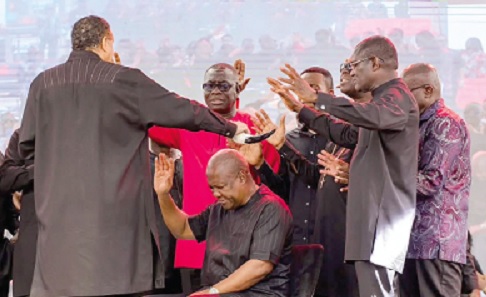 Bishop Dag Heward-Mills (left) and othe bishops praying for President John Dramani Mahama during the service