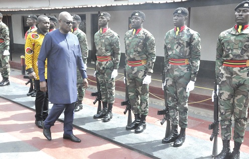 Prosper Bani (in spectacles), National Security Advisor, inspecting a quarter guard formation at the 66 Artillery Regiment
