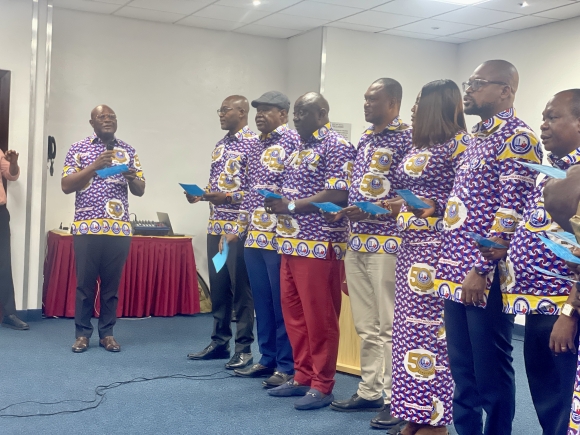 Mr Herbert Acquaye, Past President of the Ghana Hotels Association, administers the oath of office to Mr Victor Opoku Mintah and members of the newly elected executive team 