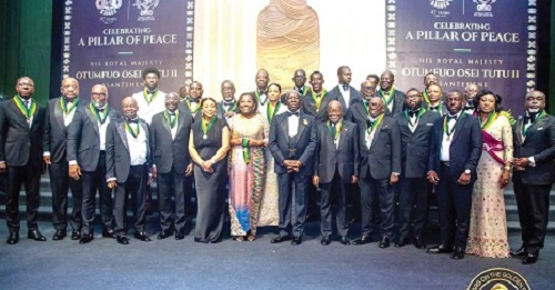 Otumfuo Osei Tutu II (7th from right), the Asantehene, flanked by Nana Addo Dankwa Akufo-Addo (6th from right) and Nana Oye Pampoe Addo, Deputy Chief of Staff, with some dignitaries and honourees after the event