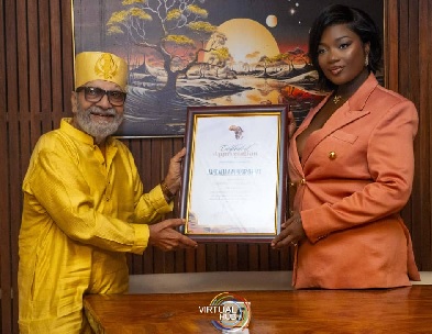 Efya receiving the citation from Jai Gulabrai,  DreamChild Foundation’s International Global Ambassador