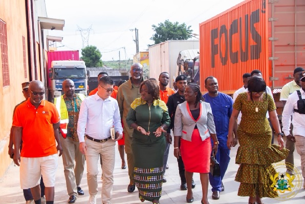 Elizabeth Ofosu-Adjare, Minister of Trade, Agribusiness and Industry interacting with Dr Andy Benzhou Xu, CEO of Focus Technology Company Ltd during the tour of the factory