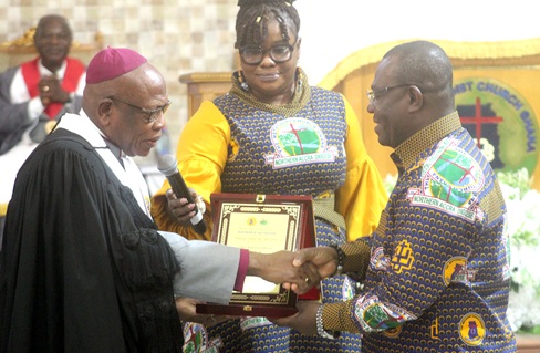 Rt Rev. Andrew Mbeah-Baiden (left), Bishop of the Northern Accra Diocese of the Methodist Church, presenting a framed certificate of recognition to Emmanuel Kwasi Bedzrah (right), the Board Chairman of the Ghana Education Trust Fund. Picture: ESTHER ADJORKOR ADJEI